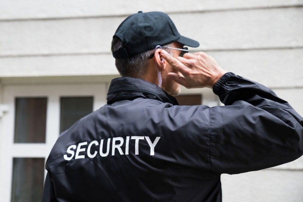 Security guard using earpiece on site