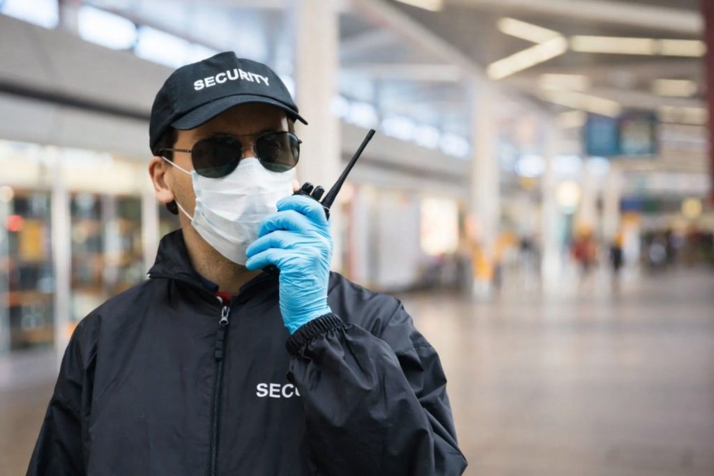 Retail security officer using radio communication in shopping centre